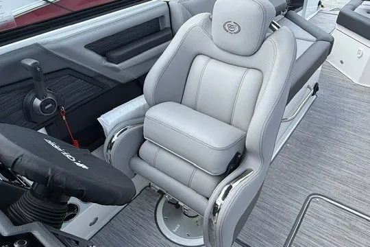 Slide: The Image of 2024 Cobalt R8 boat interior with luxurious gray captain's seat and modern controls. - 15