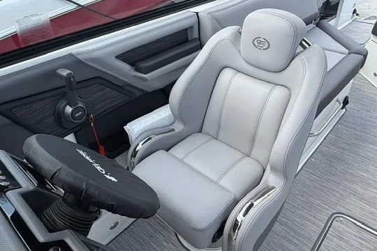 Slide: The Image of 2024 Cobalt R8 boat interior with luxurious gray captain's seat and modern controls. - 14