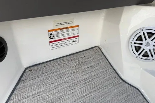 Slide: The Image of Interior of 2024 Cobalt R8 boat with speaker and warning label. - 42