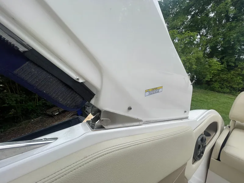 Slide: The Image of 2019 Regal 28 Express boat interior detail with open hatch and speaker. - 41