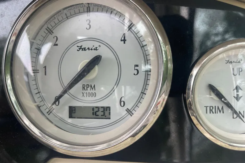 Slide: The Image of Close-up of 2019 Regal 28 Express boat tachometer and trim gauge. - 30