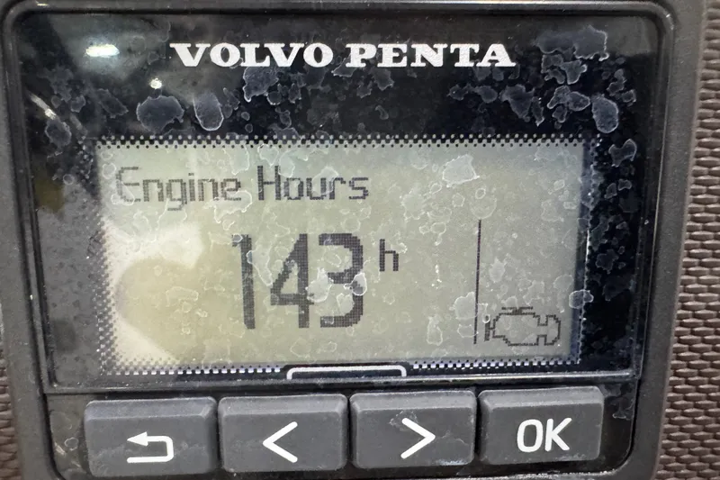 Slide: The Image of Volvo Penta engine hour meter displaying 143 hours on a Cobalt R5, 2020 model. - 14