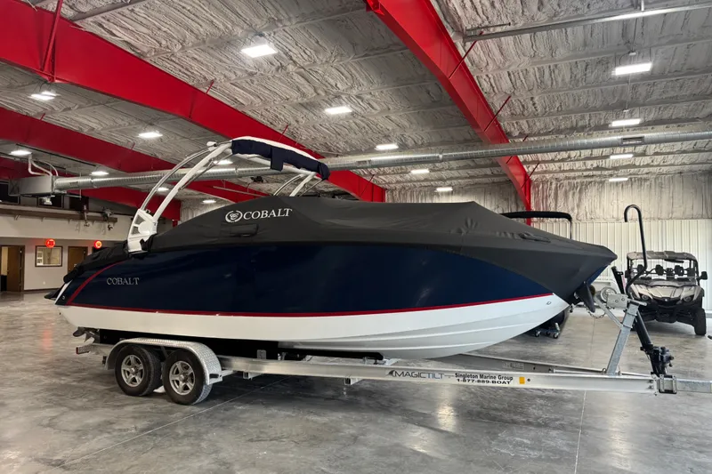 Slide: The Image of 2020 Cobalt R5 boat covered on trailer in indoor storage facility. - 7