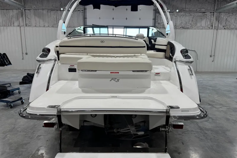 Slide: The Image of 2020 Cobalt R5 boat in a garage, showcasing sleek design and spacious seating. - 5