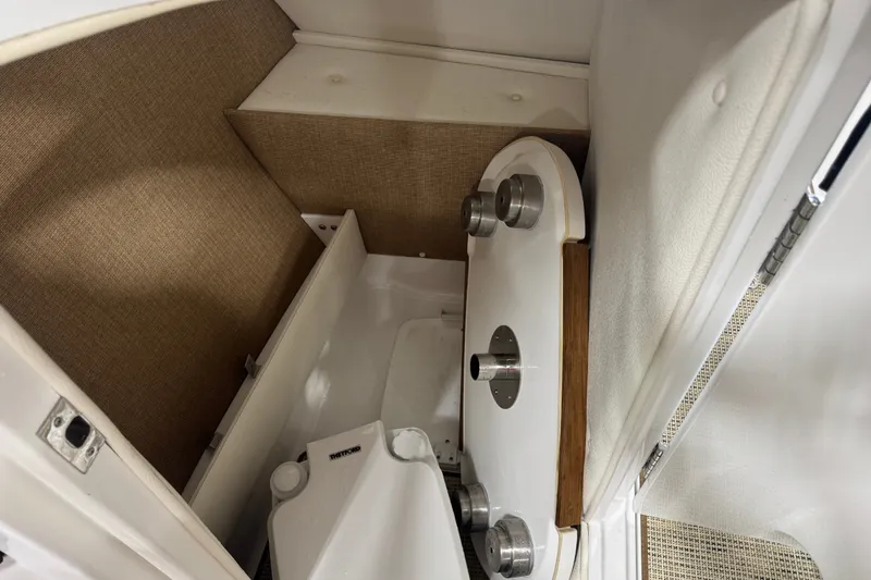 Slide: The Image of 2020 Cobalt R5 boat interior storage compartment with table and accessories. - 13