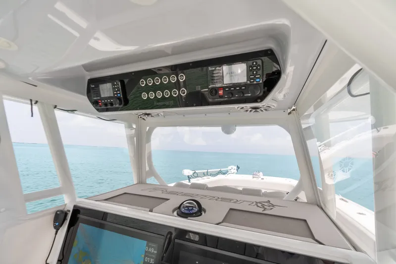 Slide: The Image of Interior view of 2023 Freeman 37 boat cockpit with navigation equipment and ocean backdrop. - 21