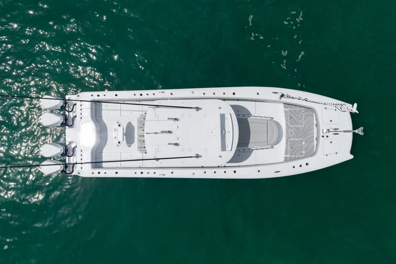 Slide: The Image of Aerial view of 2023 Freeman 37 boat on clear green water. - 15