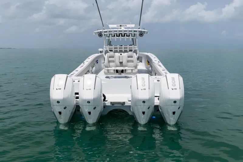 Slide: The Image of 2023 Freeman 37 boat with four powerful V8 engines on calm water. - 14