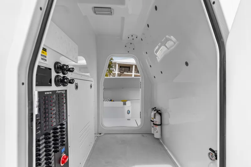 Slide: The Image of Interior of a 2023 Freeman 37 boat, featuring control panels and safety equipment. - 43