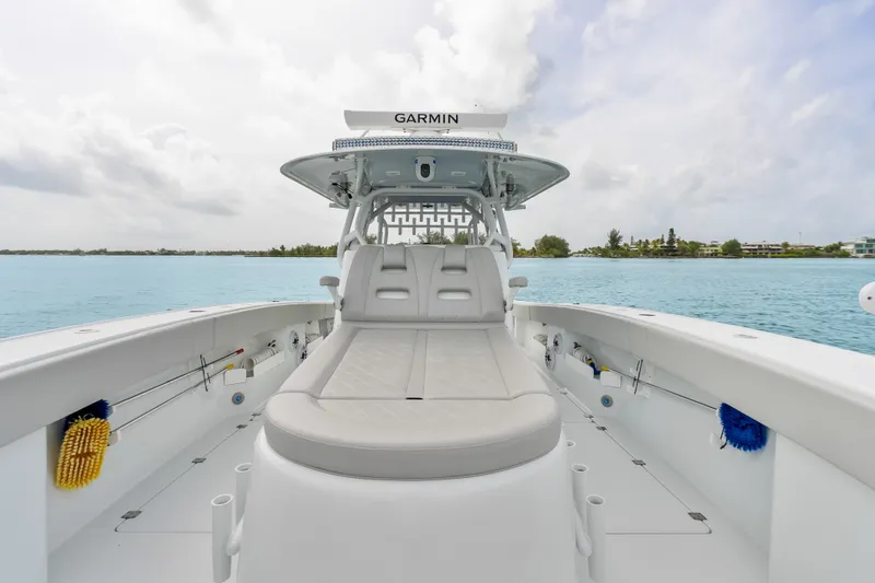 Slide: The Image of 2023 Freeman 37 boat interior with seating, Garmin equipment, and ocean view. - 37