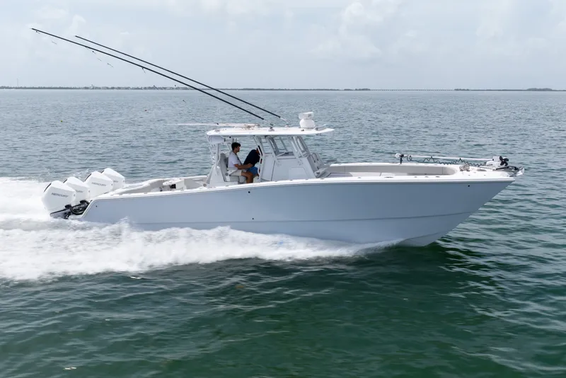 The Image of 2023 Freeman 37 boat cruising on open water with dual outboard engines. - 1