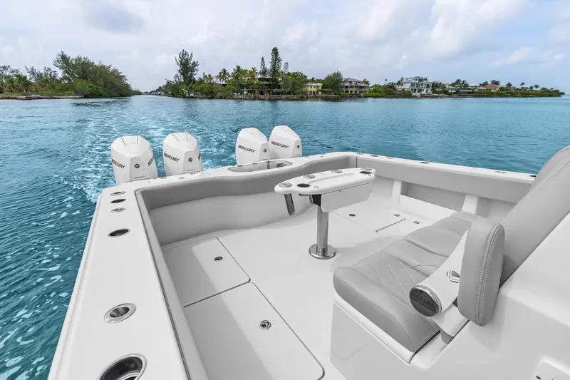 Slide: The Image of 2023 Freeman 37 boat with Mercury engines cruising on clear blue water. - 24