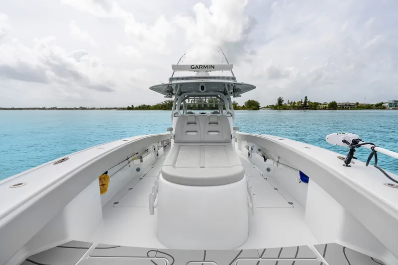 Slide: The Image of Freeman 37 boat on calm blue water, showcasing spacious deck and modern design, 2023 model. - 36