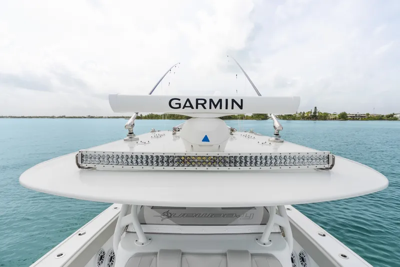 Slide: The Image of Freeman 37 boat with Garmin radar, 2023 model, on calm blue waters. - 39