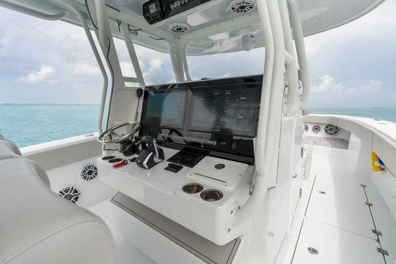 Slide: The Image of 2023 Freeman 37 boat cockpit with advanced navigation system and ocean view. - 18