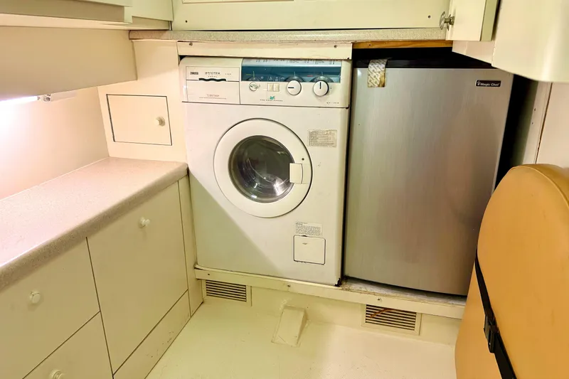 Slide: The Image of Laundry area in 2000 Fairline Squadron 55 yacht with washer and mini fridge. - 29