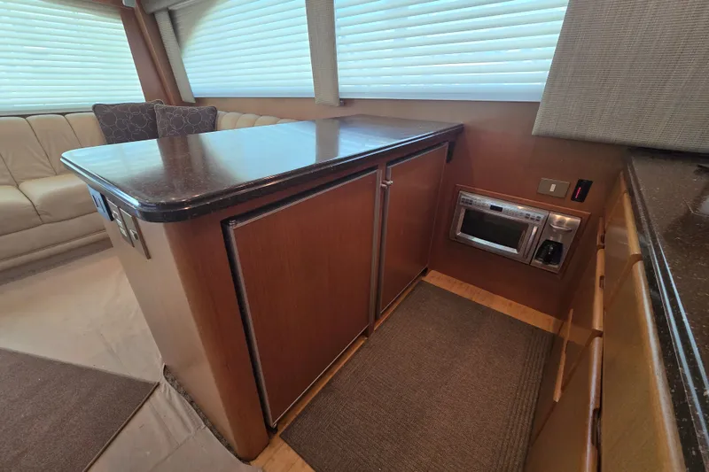 Slide: The Image of Interior of 2005 Cavileer 44 Convertible yacht with modern kitchen amenities. - 19