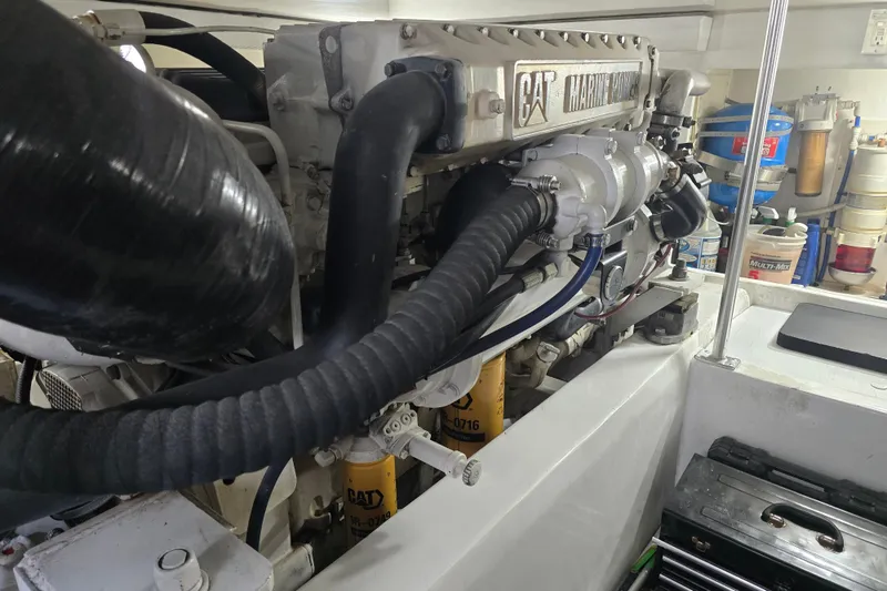 Slide: The Image of Engine room of a 2005 Cavileer 44 Convertible with CAT marine engine components. - 42