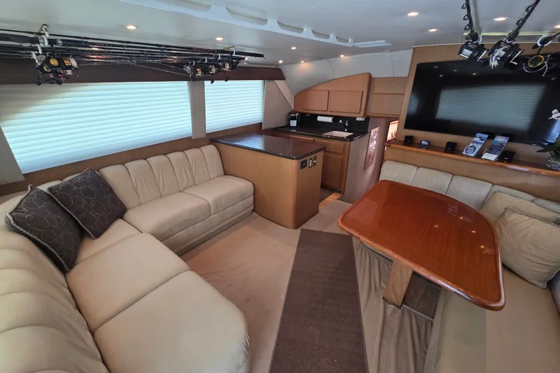 Slide: The Image of Luxurious interior of a 2005 Cavileer 44 Convertible yacht with plush seating and modern amenities. - 16