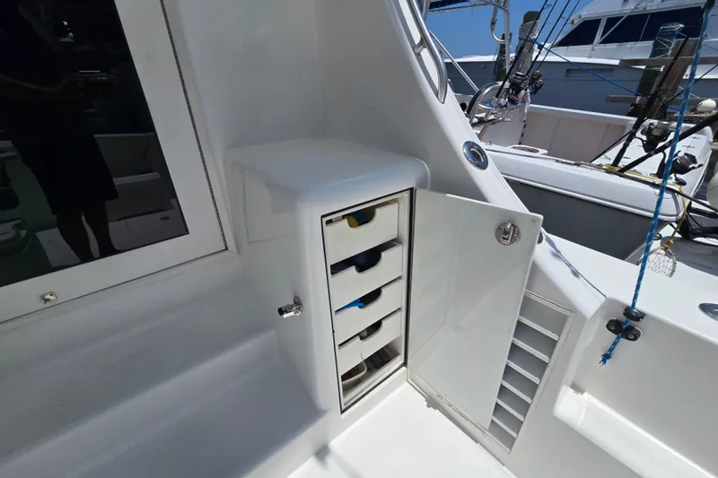Slide: The Image of Open storage compartment on 2005 Cavileer 44 Convertible boat deck. - 34