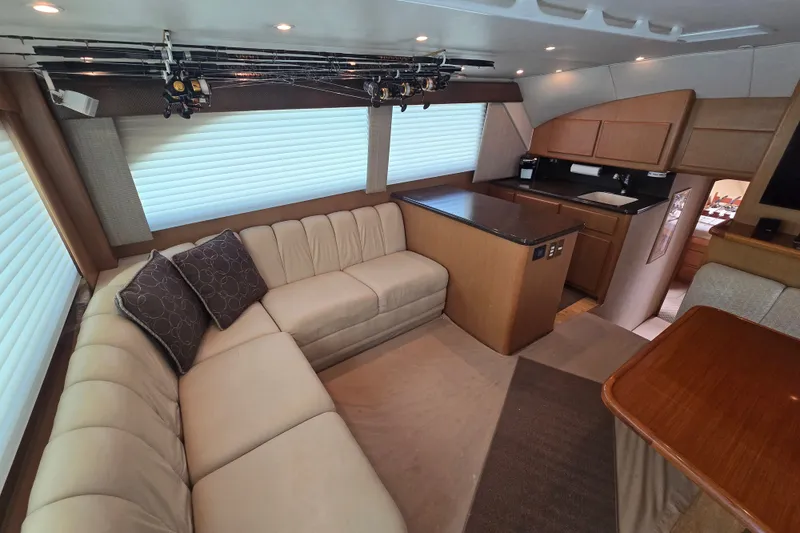 Slide: The Image of Luxurious interior of a 2005 Cavileer 44 Convertible yacht with plush seating and modern kitchen. - 14