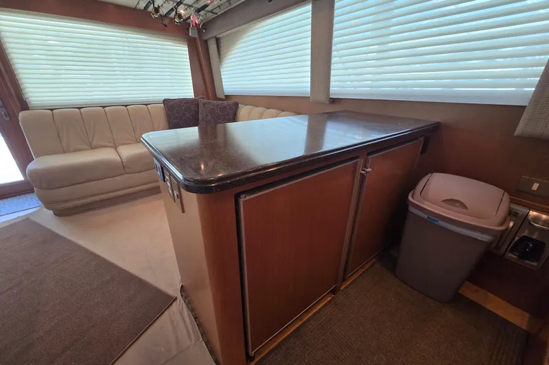 Slide: The Image of Interior of 2005 Cavileer 44 Convertible yacht with seating and kitchenette. - 18