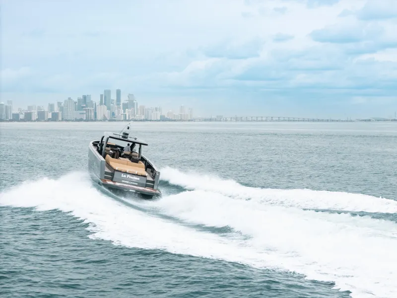 Slide: The Image of 2022 Fjord 52 Open yacht cruising near city skyline on a cloudy day. - 7