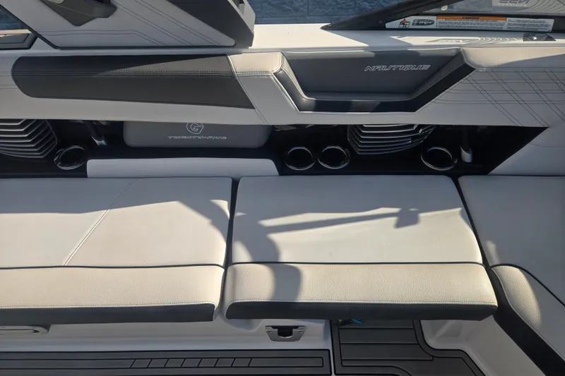 Slide: The Image of 2018 Nautique Super Air Nautique G25 interior seating with cup holders and sleek design. - 8