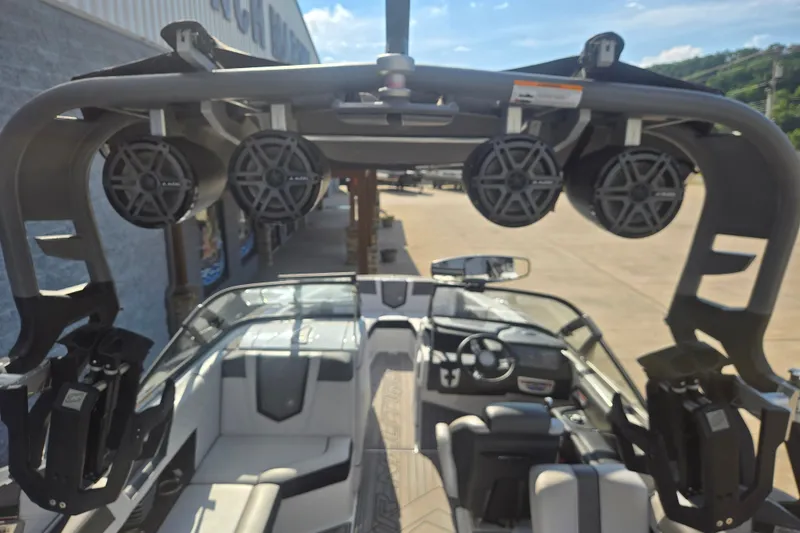 Slide: The Image of 2018 Nautique Super Air Nautique G25 interior with speakers and seating. - 18
