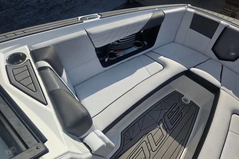 Slide: The Image of Interior of 2018 Nautique Super Air Nautique G25 boat, featuring sleek seating and cup holders. - 5