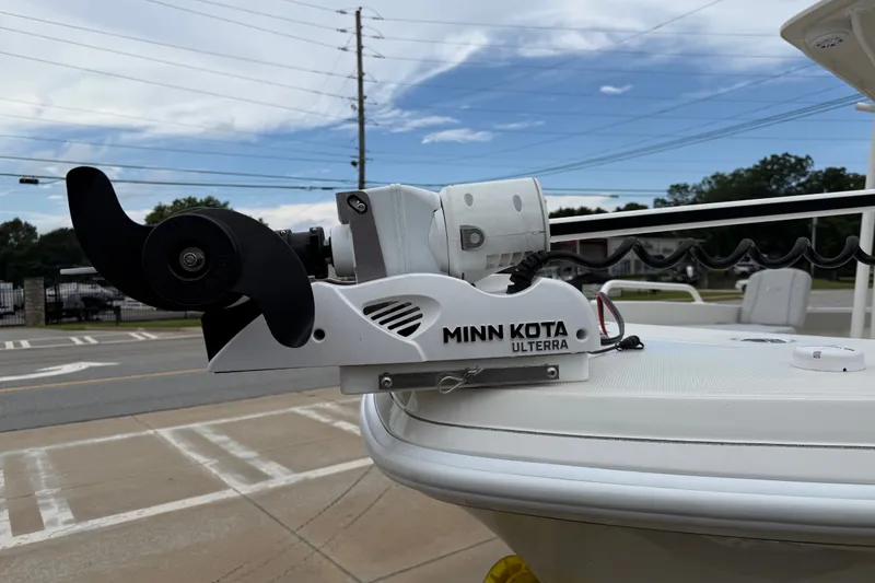 Slide: The Image of Minn Kota Ulterra motor on 2024 Ranger 2360 Bay boat, parked outdoors. - 20