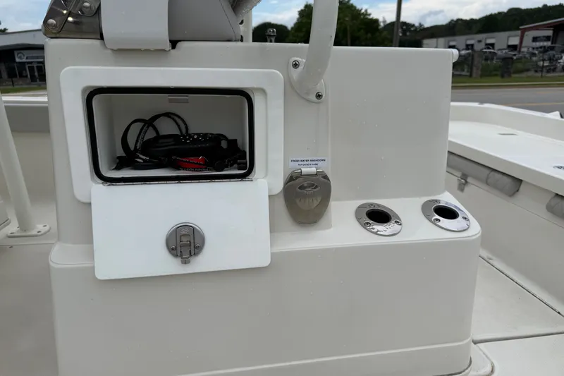 Slide: The Image of Storage compartment and controls on a 2024 Ranger 2360 Bay boat deck. - 31