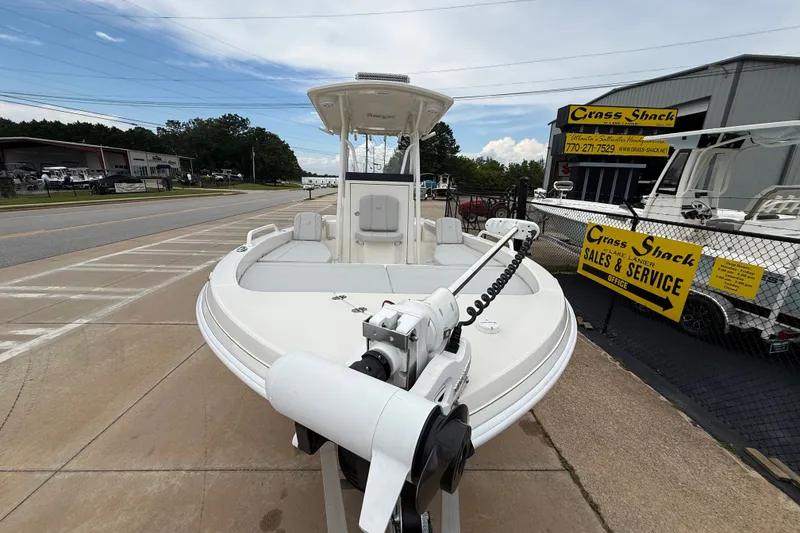 Slide: The Image of 2024 Ranger 2360 Bay boat displayed at dealership, featuring sleek design and advanced equipment. - 19