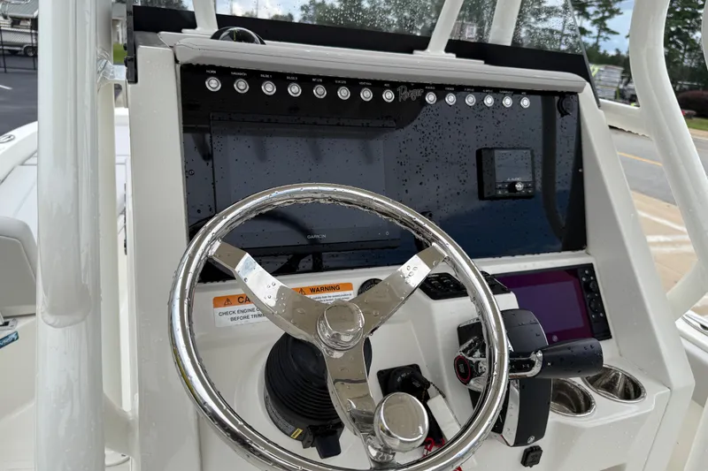 Slide: The Image of Steering console of 2024 Ranger 2360 Bay boat with modern controls and displays. - 26