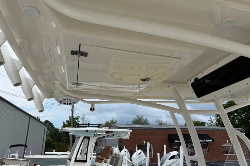 Slide: The Image of 2024 Ranger 2360 Bay boat interior with rod holders and storage compartments. - 37