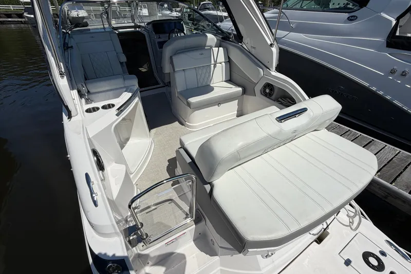 Slide: The Image of 2023 Regal 28 Express boat interior with white seating and modern design. - 7