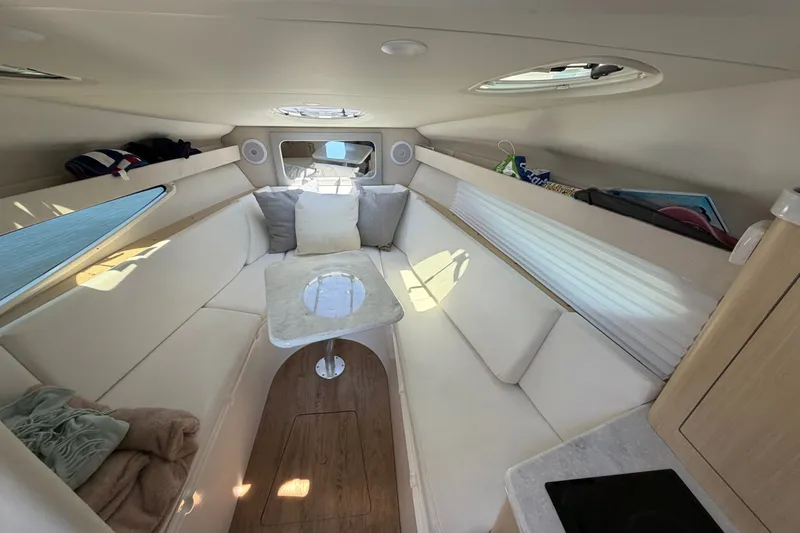 Slide: The Image of Luxurious interior of 2023 Regal 28 Express boat with cozy seating and elegant design. - 23