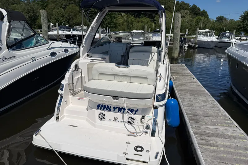 Slide: The Image of 2023 Regal 28 Express boat docked at marina, featuring spacious seating and sleek design. - 4