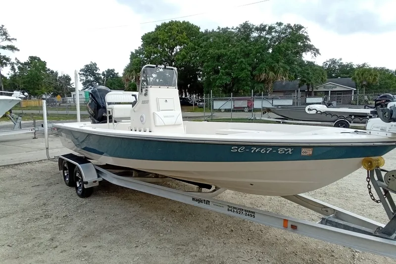 Slide: The Image of 2006 Pathfinder 2200 Tournament Edition boat on trailer, parked outdoors. - 5