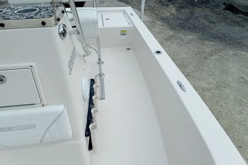 Slide: The Image of 2006 Pathfinder 2200 Tournament Edition boat interior with rod holders and storage compartments. - 21