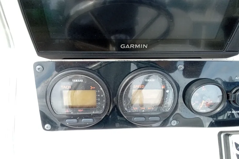 Slide: The Image of Dashboard of a 2006 Pathfinder 2200 Tournament Edition boat with Yamaha gauges and Garmin display. - 25