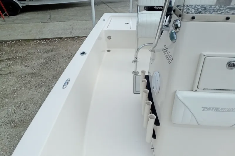 Slide: The Image of 2006 Pathfinder 2200 Tournament Edition boat interior with rod holders and seating. - 22
