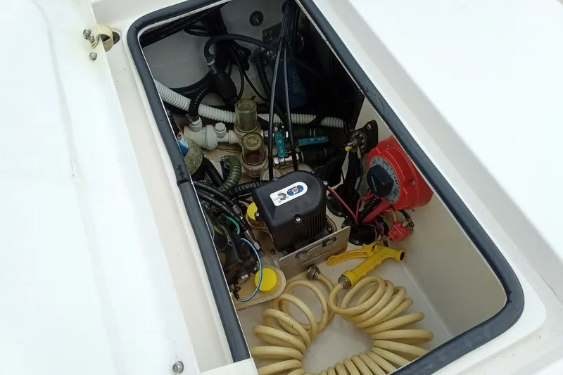 Slide: The Image of Open hatch of 2006 Pathfinder 2200 Tournament Edition boat showing internal components and wiring. - 15