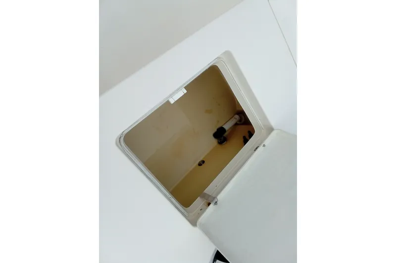 Slide: The Image of Open hatch on 2006 Pathfinder 2200 Tournament Edition boat, showing interior compartment. - 14