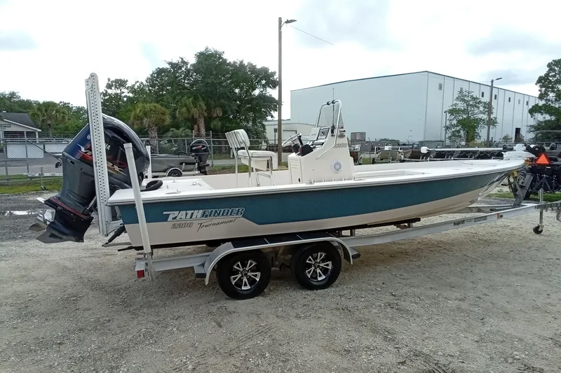 Slide: The Image of 2006 Pathfinder 2200 Tournament Edition boat on trailer, parked outdoors. - 6