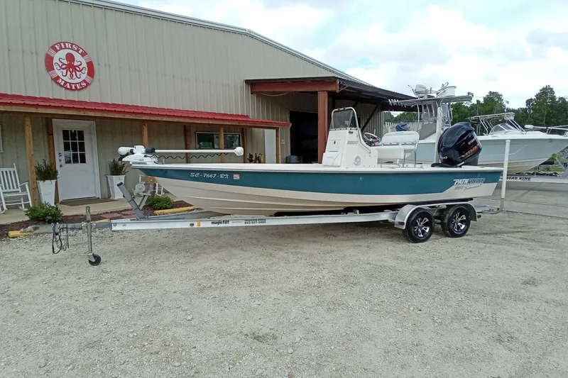 Slide: The Image of 2006 Pathfinder 2200 Tournament Edition boat on trailer outside a building. - 3