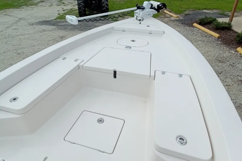 Slide: The Image of 2006 Pathfinder 2200 Tournament Edition boat deck with storage compartments and trolling motor. - 18