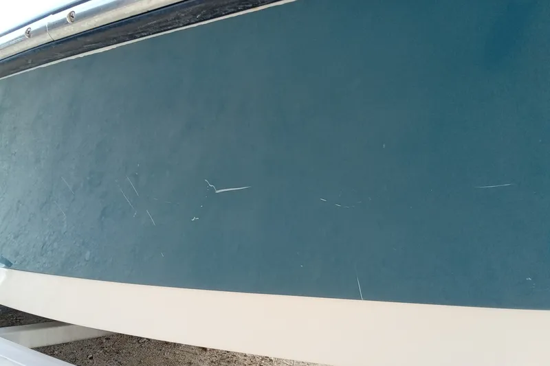 Slide: The Image of 2006 Pathfinder 2200 Tournament Edition boat hull with visible scratches. - 27