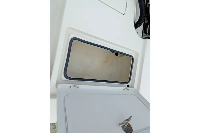 Slide: The Image of Open storage compartment on 2006 Pathfinder 2200 Tournament Edition boat. - 13
