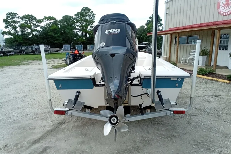 Slide: The Image of 2006 Pathfinder 2200 Tournament Edition boat on trailer, rear view with outboard motor. - 7